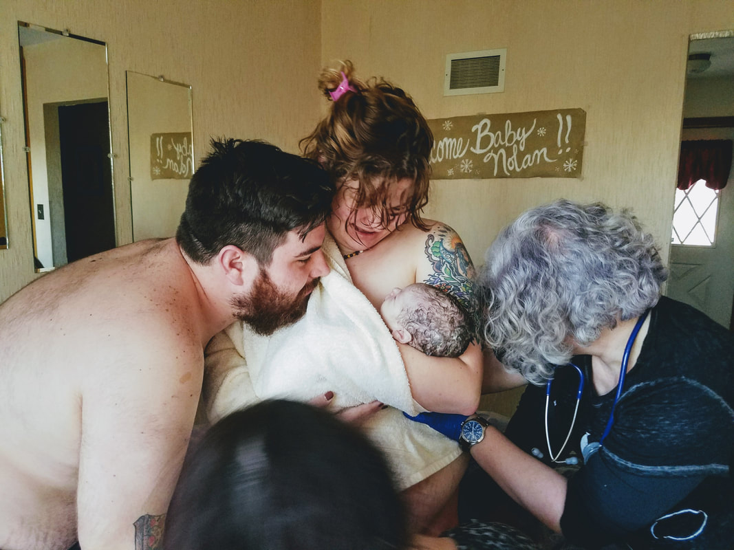 New parents greet their baby for the first time.